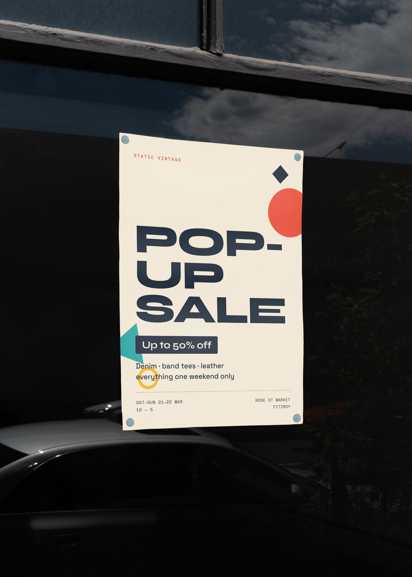 Pop-up sale poster on a car window with a dark background